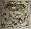 Panel 21:04 - Creature with human body, eagle's head and wings (but no halo)